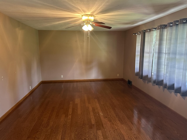 119 Cane Creek Rd, Rocky Top, TN 37769 - empty room with wood finished floors, ceiling fan, and baseboards