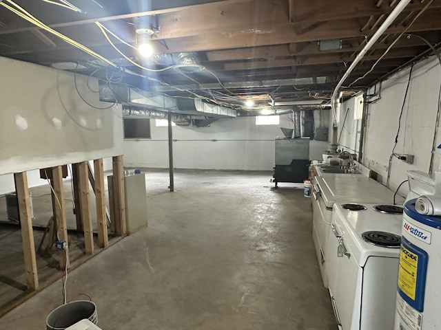 119 Cane Creek Rd, Rocky Top, TN 37769 - below grade area featuring washer / clothes dryer, water heater, and a sink