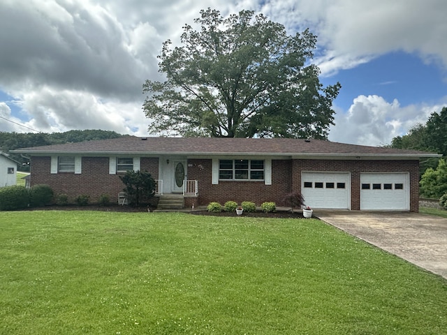 119 Cane Creek Rd, Rocky Top, TN 37769 - single story home with an attached garage, driveway, a front yard, and brick siding