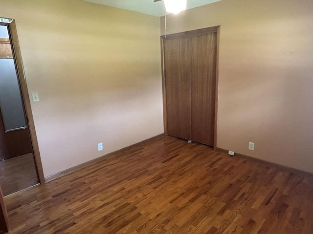 119 Cane Creek Rd, Rocky Top, TN 37769 - unfurnished bedroom featuring wood finished floors, baseboards, a closet, and ceiling fan