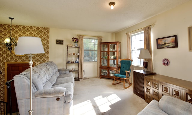 carpeted living room featuring a textured ceiling