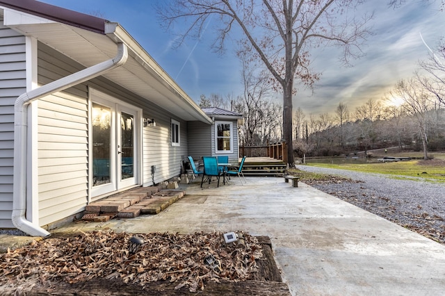 view of patio featuring a deck and outdoor dining space