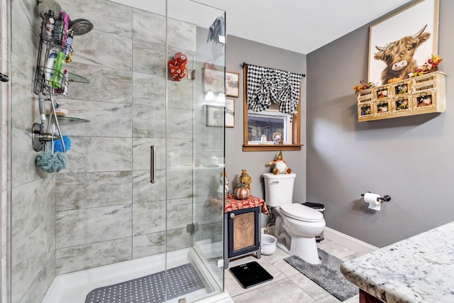 bathroom with vanity, an enclosed shower, and toilet