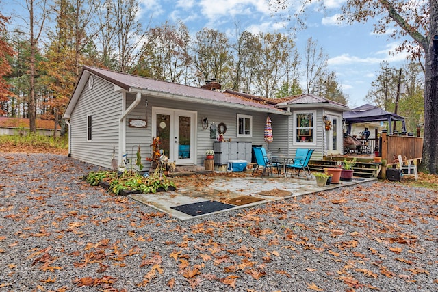 view of front of property featuring a patio area and a deck