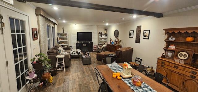 dining area with beam ceiling, dark hardwood / wood-style flooring, and crown molding