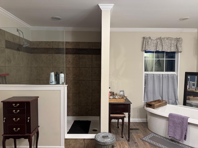 bathroom featuring hardwood / wood-style flooring, ornamental molding, and shower with separate bathtub