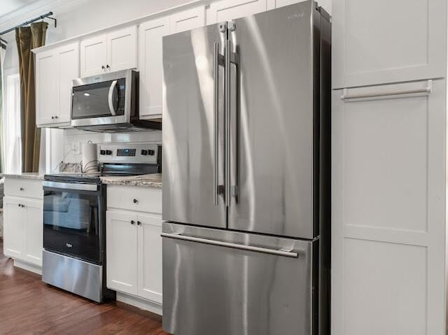 1323 Chippewa Ave SE, Cleveland, TN 37311 - kitchen with stainless steel appliances, dark wood-style floors, and white cabinetry