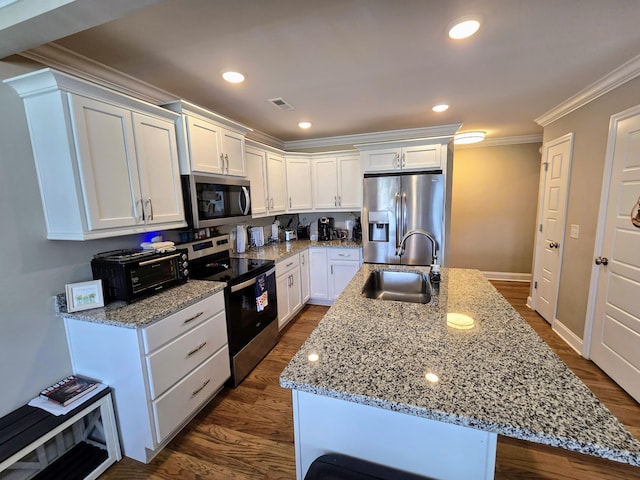 kitchen with ornamental molding, stainless steel appliances, sink, a center island with sink, and white cabinets