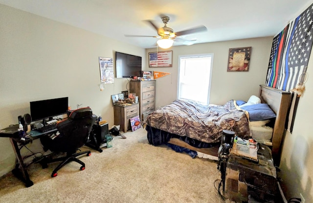 bedroom featuring light carpet and ceiling fan