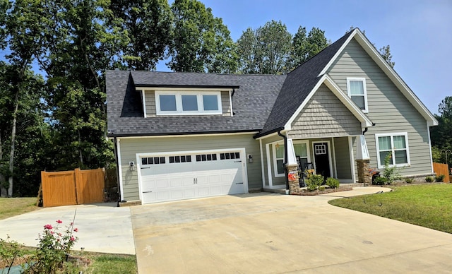 craftsman-style house with a front lawn and a garage