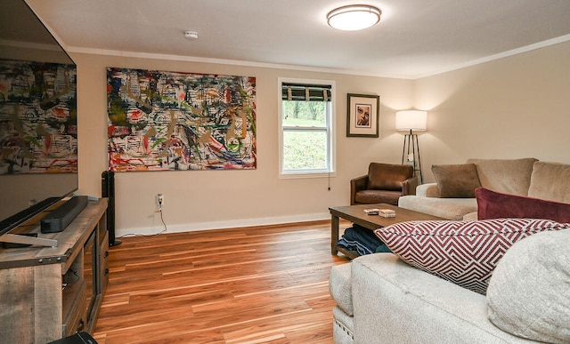 living room featuring hardwood / wood-style flooring and ornamental molding