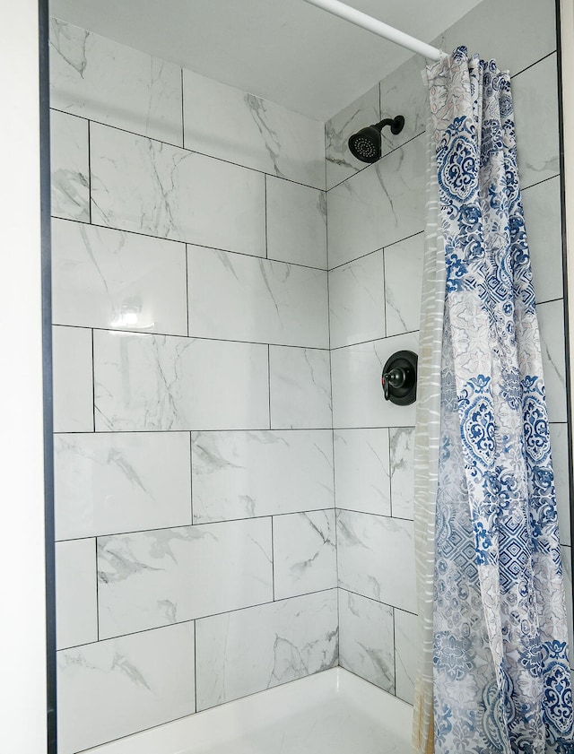 bathroom with a shower with curtain