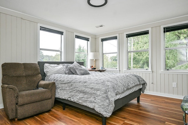 bedroom with dark wood-type flooring