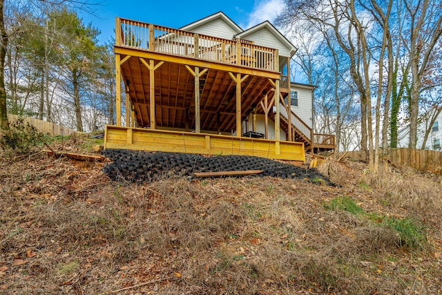 back of house featuring a deck