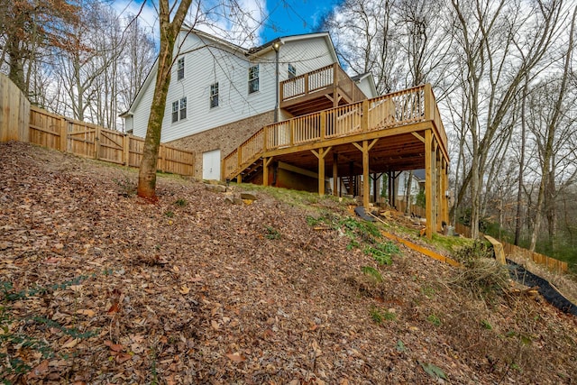 rear view of house with a wooden deck