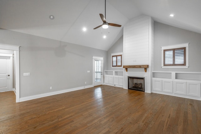 unfurnished living room featuring wood-type flooring, high vaulted ceiling, ceiling fan, and a fireplace