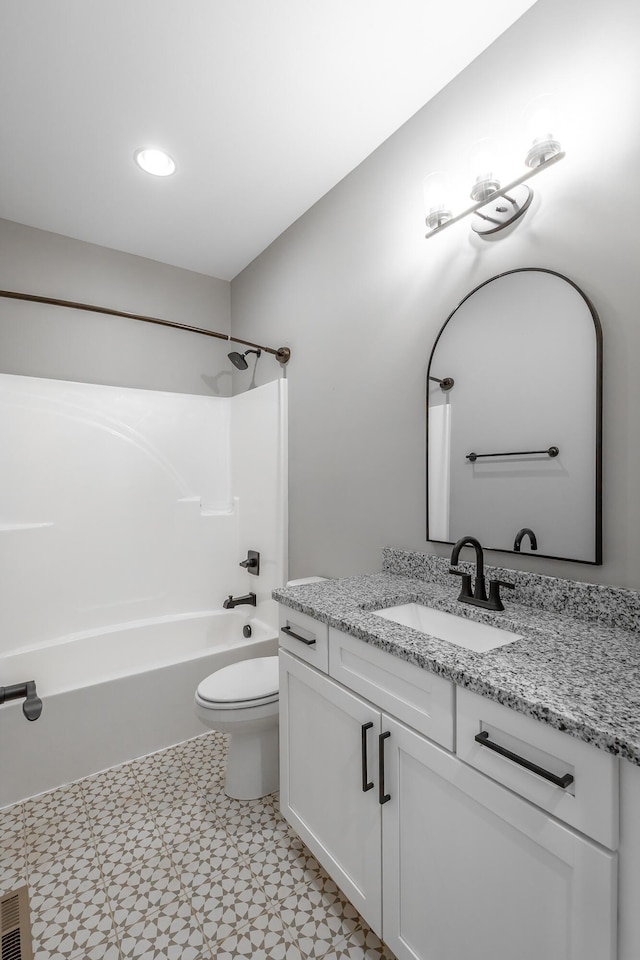 full bathroom featuring vanity, shower / tub combination, and toilet