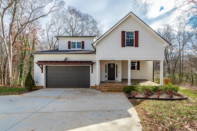 view of front of home with a garage and covered porch