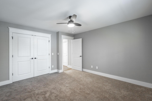 unfurnished bedroom featuring light carpet, a closet, and ceiling fan