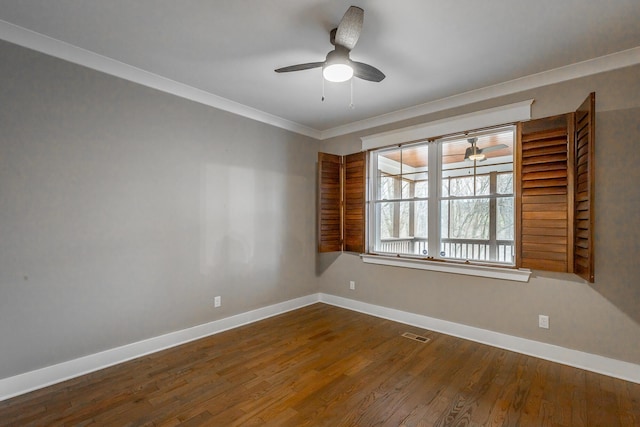 spare room featuring ornamental molding, dark hardwood / wood-style floors, and ceiling fan