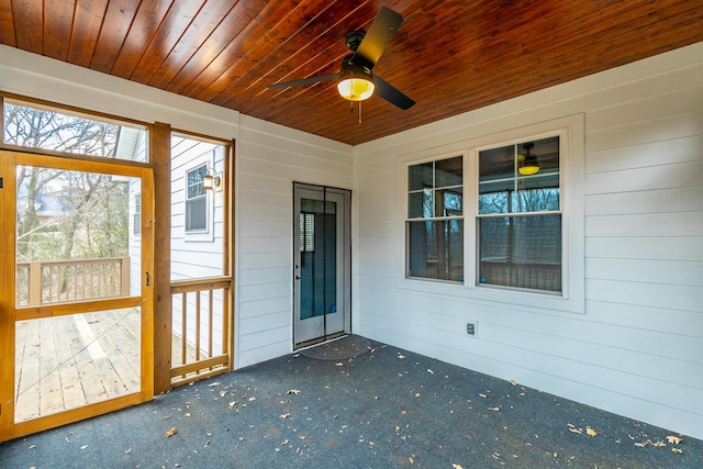 exterior space with ceiling fan and wooden ceiling