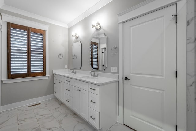 bathroom with crown molding and vanity