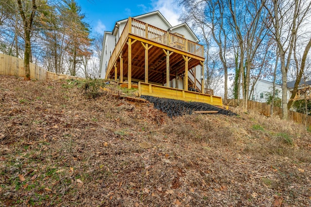 back of house featuring a deck