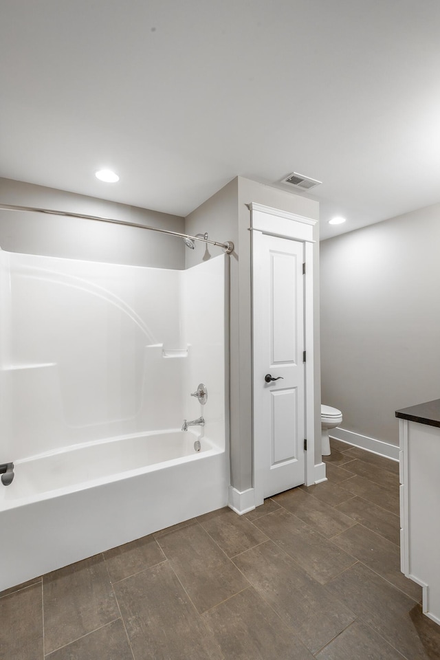 full bathroom with shower / washtub combination, toilet, and vanity