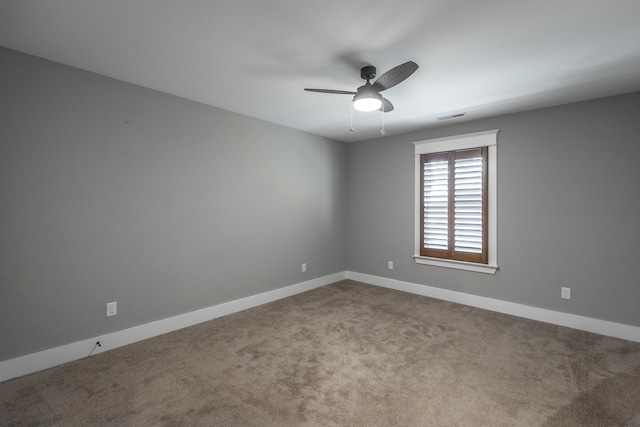 unfurnished room featuring carpet floors and ceiling fan