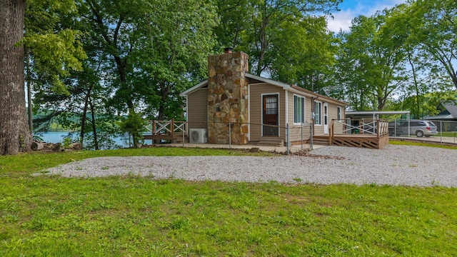 1336 Whites Creek Rd, Spring City, TN 37381 - view of side of home featuring a wooden deck and a chimney