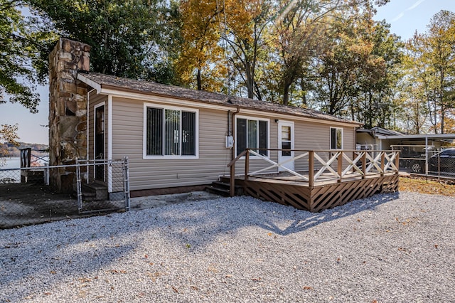 1336 Whites Creek Rd, Spring City, TN 37381 - view of front of property featuring fence, a wooden deck, and a chimney