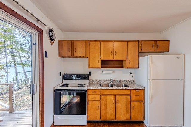 kitchen featuring sink, dark hardwood / wood-style floors, white appliances, and ornamental molding