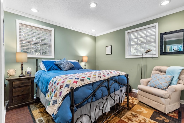 bedroom featuring a textured ceiling, dark hardwood / wood-style floors, and crown molding