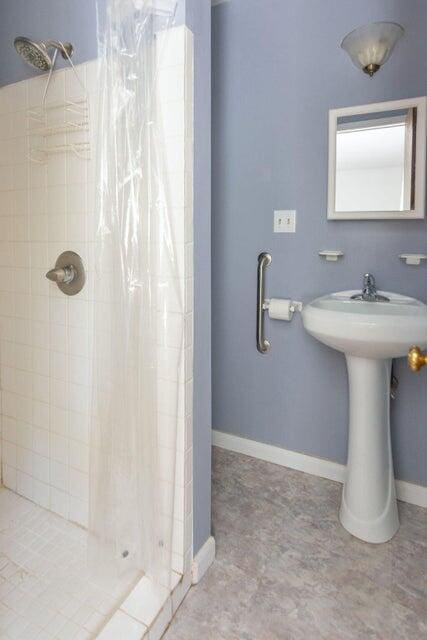 bathroom with a shower with curtain