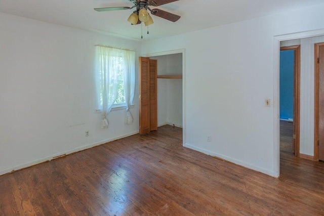 unfurnished bedroom featuring a closet, ceiling fan, and hardwood / wood-style floors