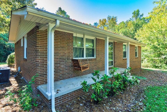 view of side of property with cooling unit