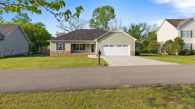 ranch-style house with concrete driveway, a front yard, and a garage