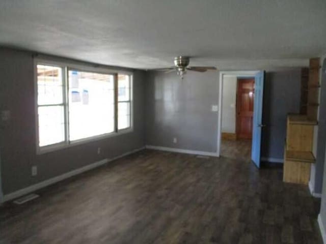 unfurnished living room featuring ceiling fan