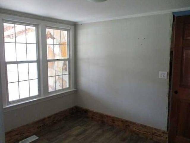 empty room with wood-type flooring