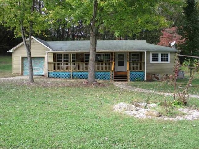 ranch-style house with a garage, a front lawn, and a porch