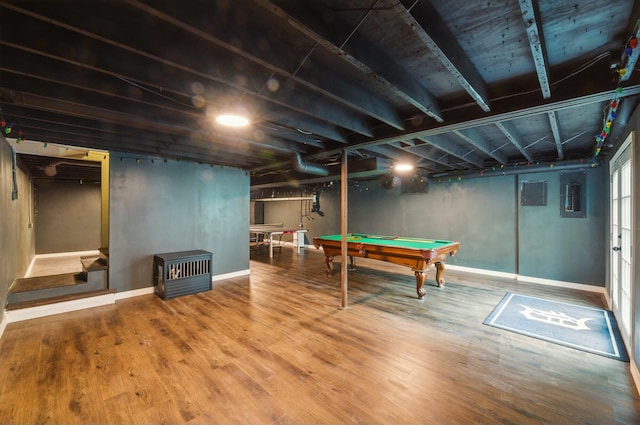 game room with electric panel, pool table, baseboards, and wood finished floors