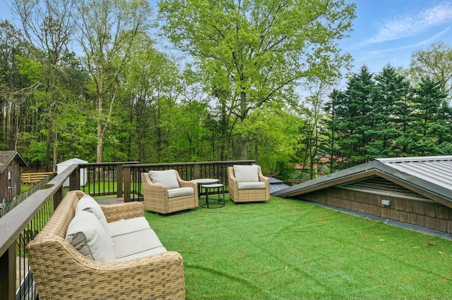view of yard with a wooden deck and an outdoor hangout area