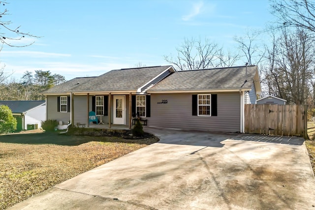 single story home with covered porch and a front lawn