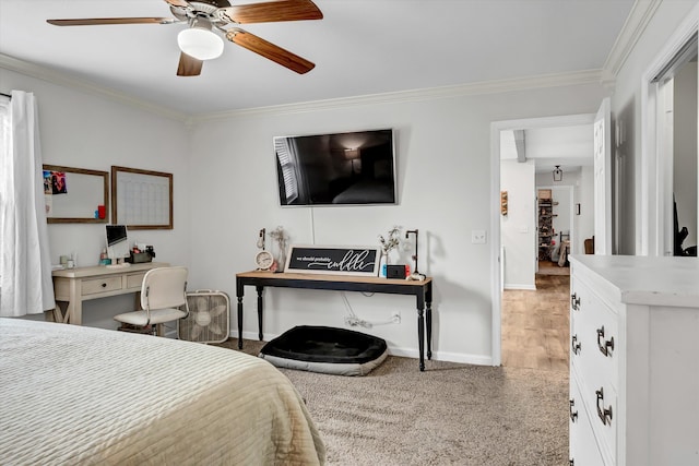 bedroom with ceiling fan, carpet floors, and ornamental molding