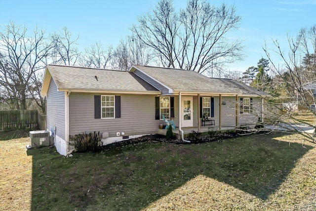 ranch-style home featuring a front yard, covered porch, and central air condition unit