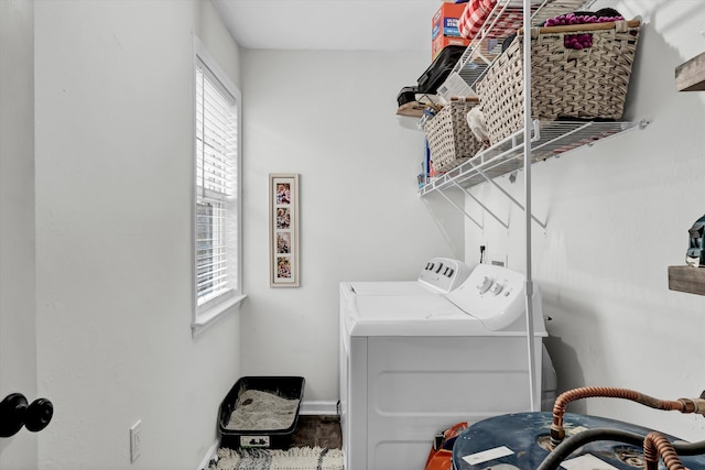 laundry room with washing machine and clothes dryer