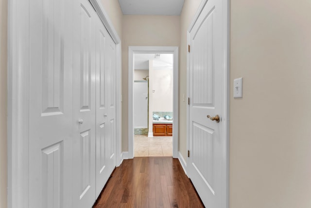 corridor featuring dark hardwood / wood-style flooring