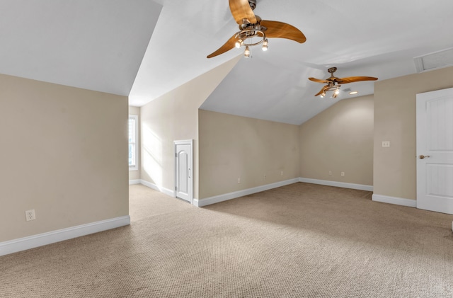 bonus room with light carpet, ceiling fan, and vaulted ceiling