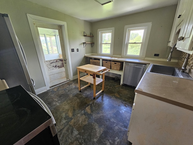 2783 No Pone Rd NW, Georgetown, TN 37336 - kitchen featuring appliances with stainless steel finishes, white cabinetry, and stone finish flooring