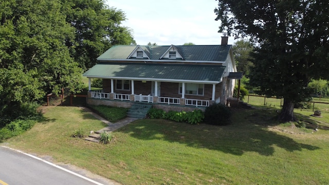 2783 No Pone Rd NW, Georgetown, TN 37336 - view of front of house with a chimney, a porch, a front yard, and a metal roof